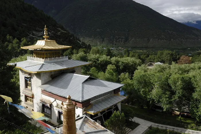 Framed Print : Lamaling, Tibetan Buddhist monastery in front of wooded mountains of the Himalayas Framed Print : Lamaling, Tibetan Buddhist monastery in front of wooded mountains of the Himalayas