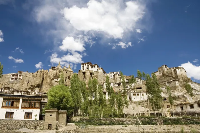 Framed Print : Lamayuru Buddhist Monastery rising above mass of eroded cliffs on Leh Kargil road with Poplar