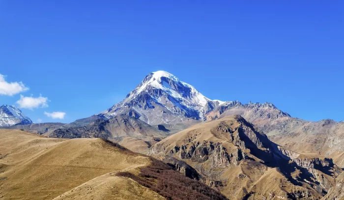Framed Print : Landscape high rocky mountains of the Caucasus in Georgia on a background of blue sky and clouds