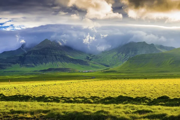 Framed Print : Landscape with meadow and mountains in the evening light