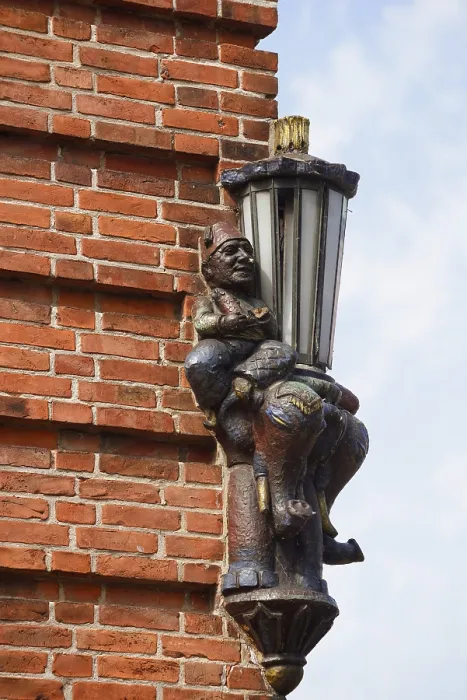 Framed Print : Lantern and sculpture on a house wall Framed Print : Lantern and sculpture on a house wall