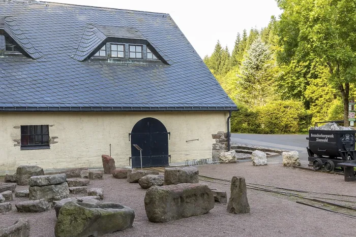 Framed Print : Lapidarium with stone evidence of mining machine technology in front of the hat house of the Vereinigt Zwitterfeld