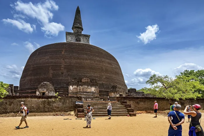 Framed Print : Large ancient stupa with people in the foreground on a sunny day Framed Print : Large ancient stupa with people in the foreground on a sunny day