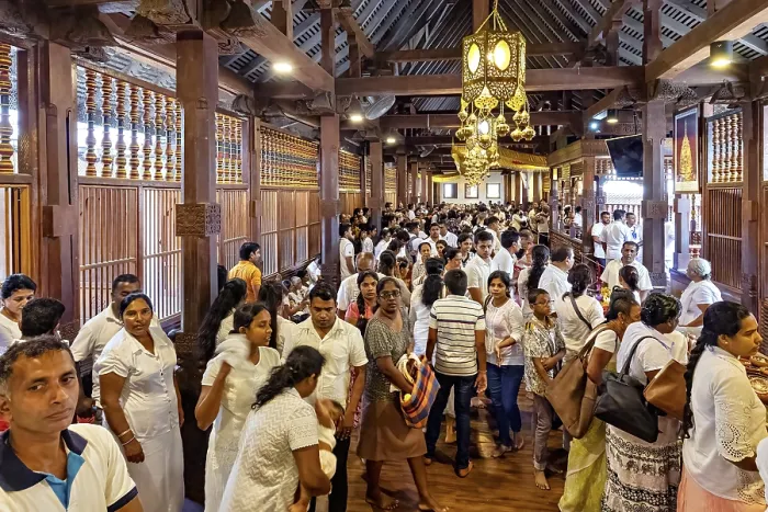 Framed Print : Large crowd in an interior decorated with wooden beams at a meeting