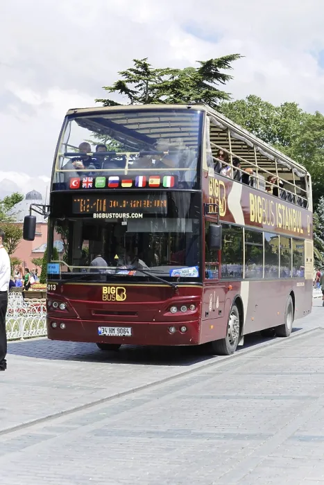 Framed Print : Large double-decker bus drives tourists through the streets