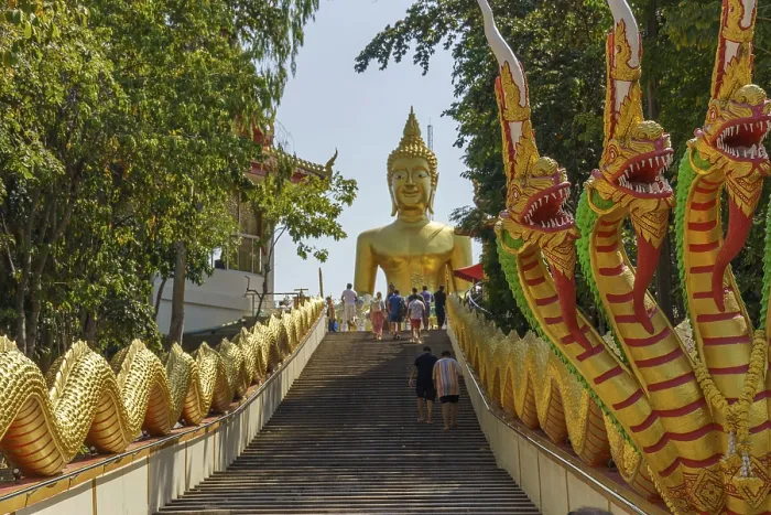 Framed Print : Large golden Buddha statue at the end of a staircase