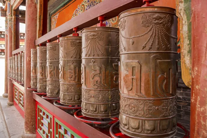 Framed Print : Large permanently installed prayer wheels in a temple of the Kumbum Monastery in Xining