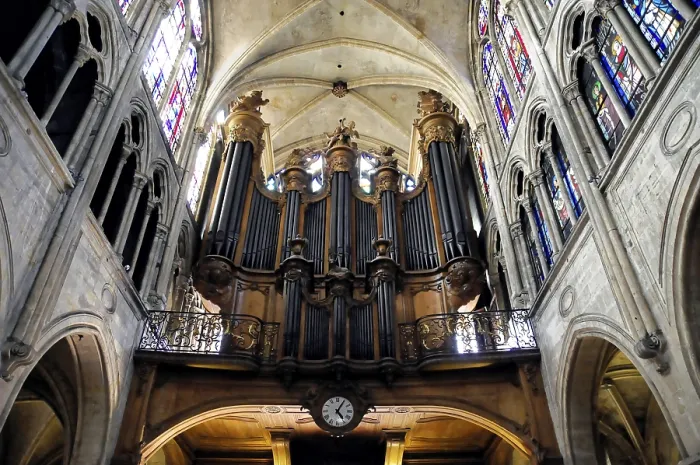 Framed Print : Large pipe organ in a Gothic nave with stained glass windows