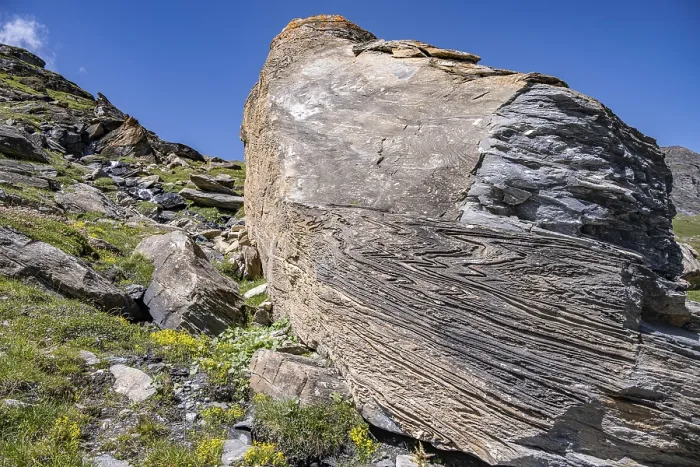 Framed Print : Large rock in the foreground shows fascinating rock structures under a blue sky Framed Print : Large rock in the foreground shows fascinating rock structures under a blue sky