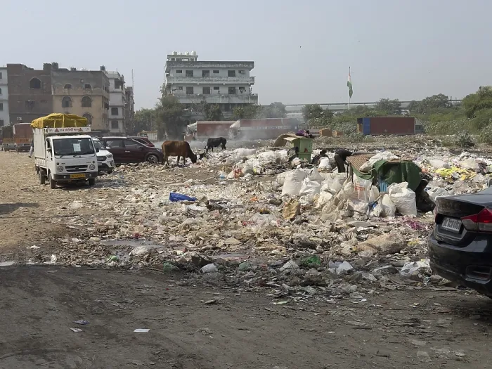 Framed Print : Large-scale waste disposal on a road with vehicles