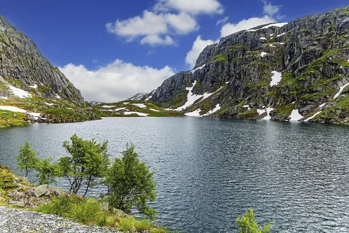 Framed Print : Large snowfields is reflected in the water of the lake