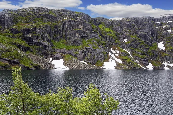 Framed Print : Large snowfields is reflected in the water of the lake