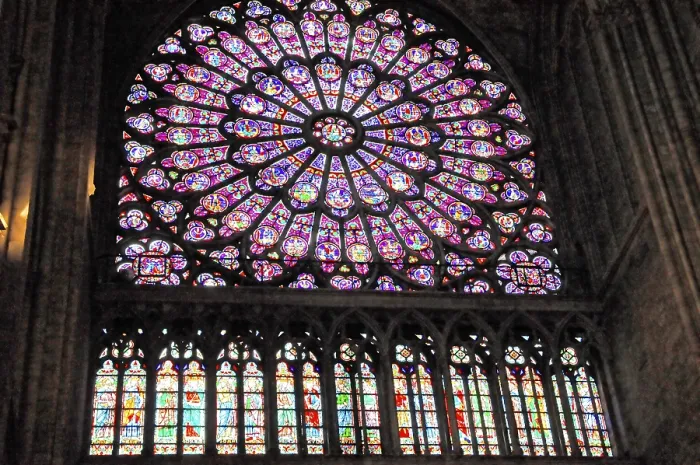 Framed Print : Large stained glass rose window in the Notre Dame with intense colours Framed Print : Large stained glass rose window in the Notre Dame with intense colours