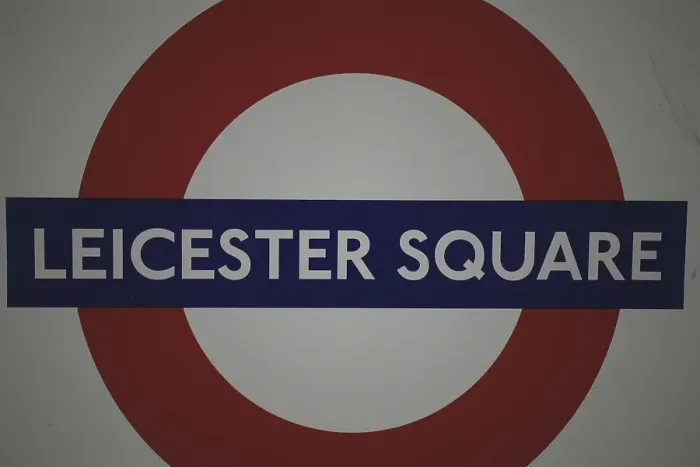 Framed Print : Leicester Square tube sign and underground station