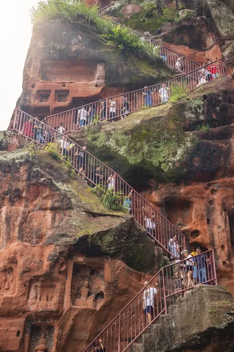 Framed Print : Leshan, China - July 2019 : Crowds of tourists walking down the plank walk around Giant Leshan Buddha monument