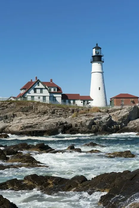 Framed Print : Lighthouse, waves breaking on rocks