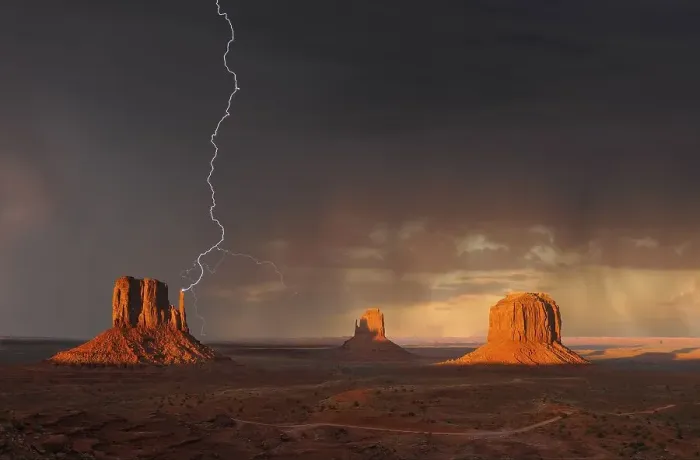Framed Print : Lightning strikes during a thunderstorm in the evening light
