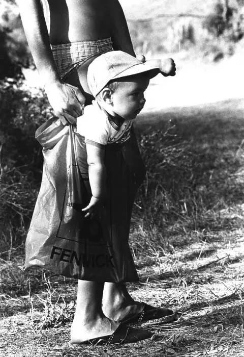 Framed Print : A little boy is carried in a plastic bag Framed Print : A little boy is carried in a plastic bag