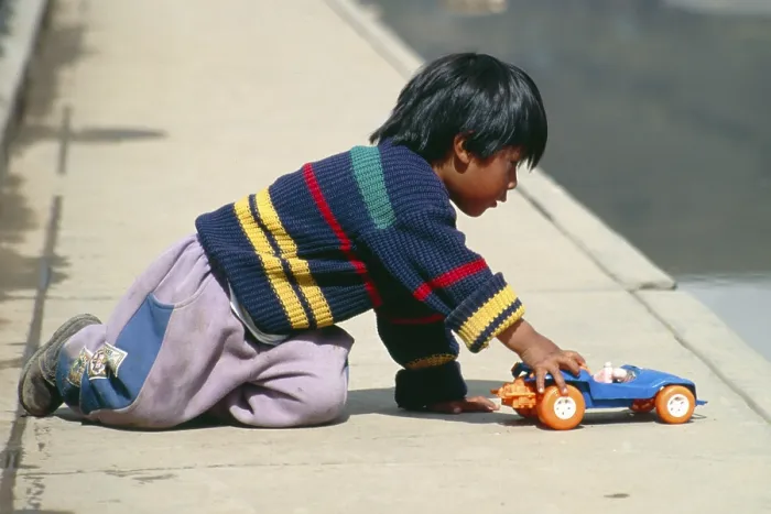 Framed Print : Little boy playing with toy car Framed Print : Little boy playing with toy car