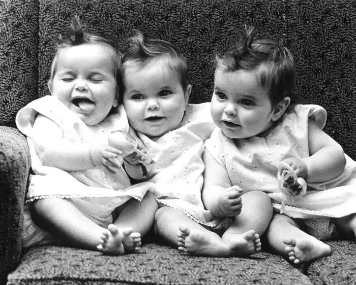 Framed Print : Three little girls sitting in an armchair