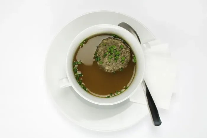 Framed Print : Liver dumplings in beef broth, sprinkled with chives