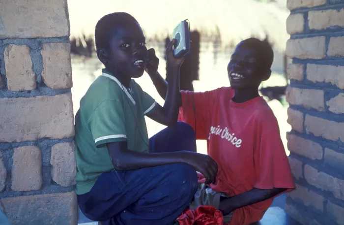 Framed Print : Two local boys with Walkman in a village near Kande Framed Print : Two local boys with Walkman in a village near Kande