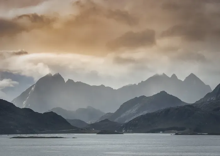 Framed Print : Lofoten mountains in haze and clouds by the fjord