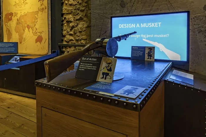 Framed Print : London, United Kingdom - 17 May 2025: Historical weapon replica in a modern interactive display