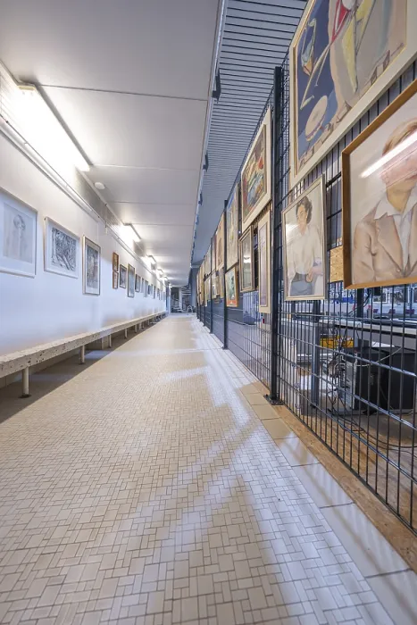 Framed Print : Long corridor in a gallery, lined with works of art on the walls Framed Print : Long corridor in a gallery, lined with works of art on the walls