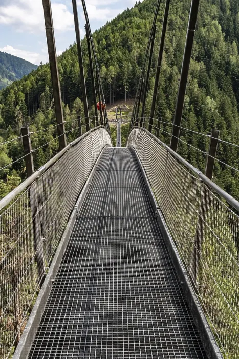 Framed Print : Long suspension bridge over a forest gorge in the South Tyrolean Alps