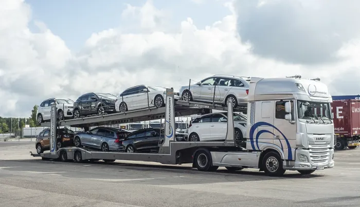 Framed Print : A lorry transports several new cars