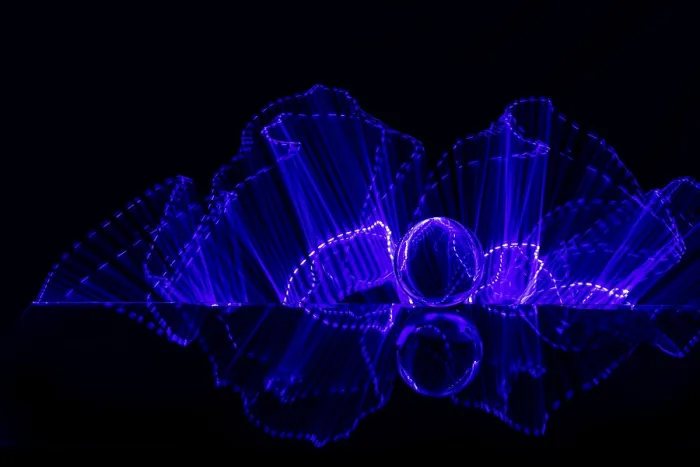 Framed Print : Luminous purple lines and a sphere create a futuristic atmosphere on a black background Framed Print : Luminous purple lines and a sphere create a futuristic atmosphere on a black background