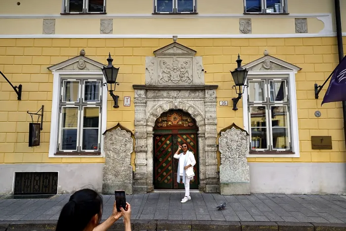 Framed Print : The magnificent facade of the Guild House in the Old Town attracts tourists with its architecture