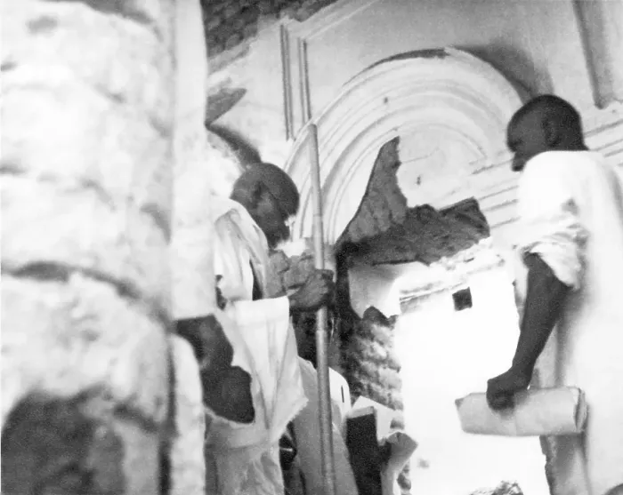 Framed Print : Mahatma Gandhi and others entering a house damaged by the riots between Hindus and Muslims in Noakhali East Bengal Framed Print : Mahatma Gandhi and others entering a house damaged by the riots between Hindus and Muslims in Noakhali East Bengal