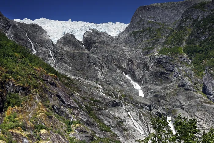 Framed Print : Majestic glacier tongue of Supphellebreen surrounded by rugged mountain terrain