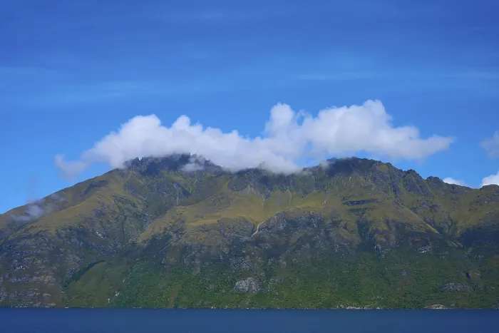 Framed Print : Majestic mountains with clouds against a clear blue sky Framed Print : Majestic mountains with clouds against a clear blue sky