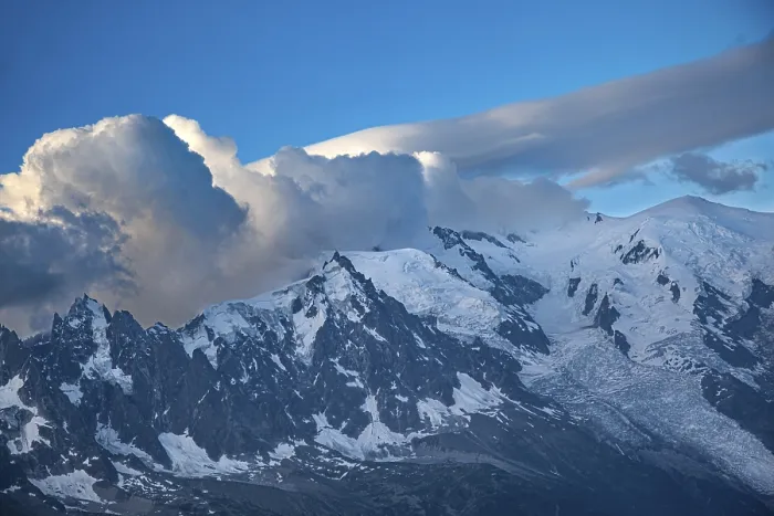 Framed Print : Majestic snow-capped mountains under dramatic cloud formations Framed Print : Majestic snow-capped mountains under dramatic cloud formations