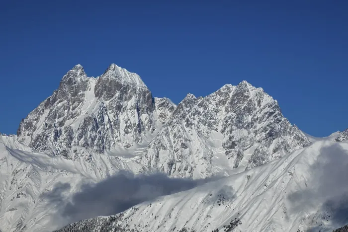 Framed Print : Majestic snow-covered mountain peaks tower under a clear blue sky