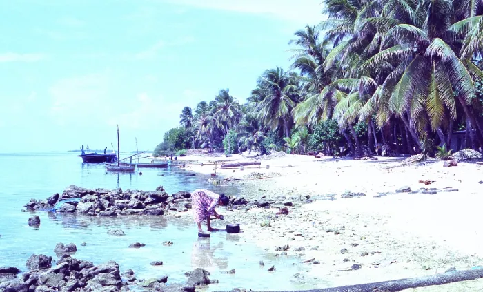 Framed Print : Maldives: Local woman on less idyllic beach Framed Print : Maldives: Local woman on less idyllic beach