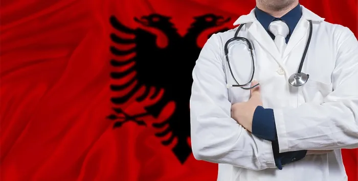 Framed Print : Male doctor with stethoscope on Albania flag