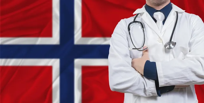 Framed Print : Male doctor with stethoscope on Norway flag