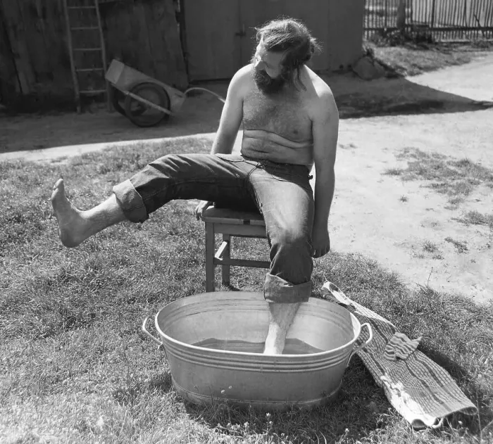 Framed Print : Man bathing his feet, Leipzig, GDR Framed Print : Man bathing his feet, Leipzig, GDR