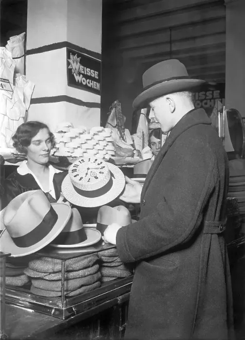 Framed Print : Man buying a hat, historical photo, circa 1920 Framed Print : Man buying a hat, historical photo, circa 1920
