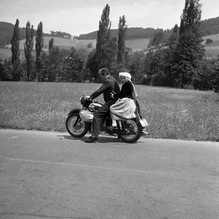 Framed Print : Man and daughter riding a motorbike on a country road Framed Print : Man and daughter riding a motorbike on a country road
