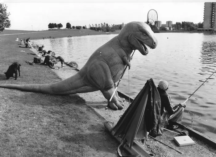 Framed Print : Man and Dino fishing, England, Great Britain Framed Print : Man and Dino fishing, England, Great Britain