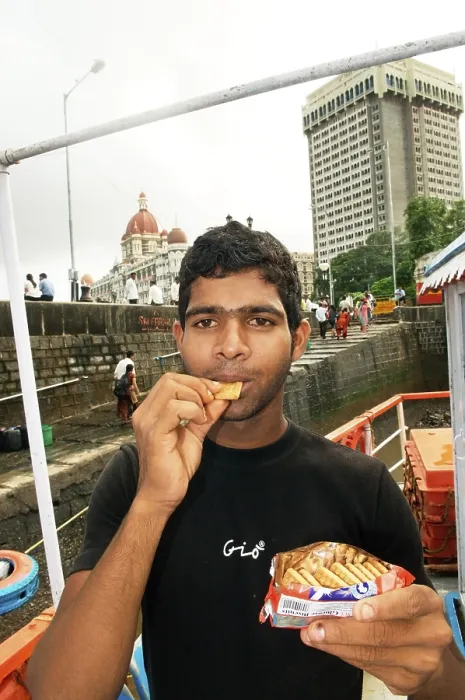 Framed Print : Man eating oil soaked biscuit packets due to container ship chitra colliding in sea Bombay Mumbai
