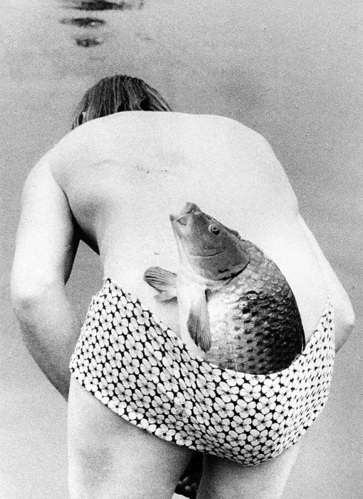 Framed Print : Man with fish in swimsuit ca. 1970s