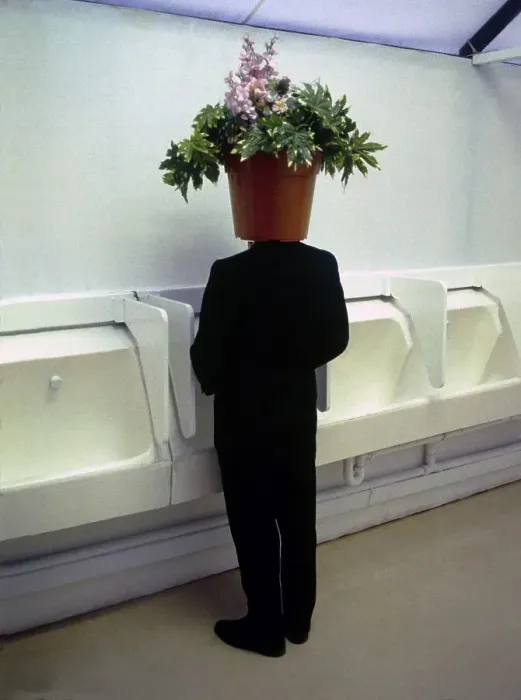 Framed Print : Man with flowerpot on his head in the toilet Framed Print : Man with flowerpot on his head in the toilet