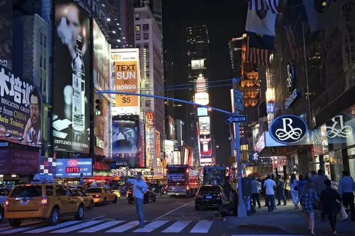 Framed Print : Man hailing a taxi at the evening at Times Square Framed Print : Man hailing a taxi at the evening at Times Square