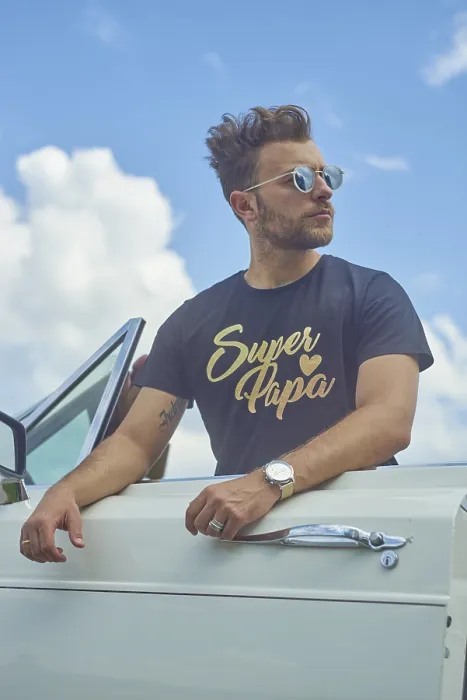 Framed Print : Man leaning on a white convertible with sunglasses against a bright blue sky with clouds Framed Print : Man leaning on a white convertible with sunglasses against a bright blue sky with clouds